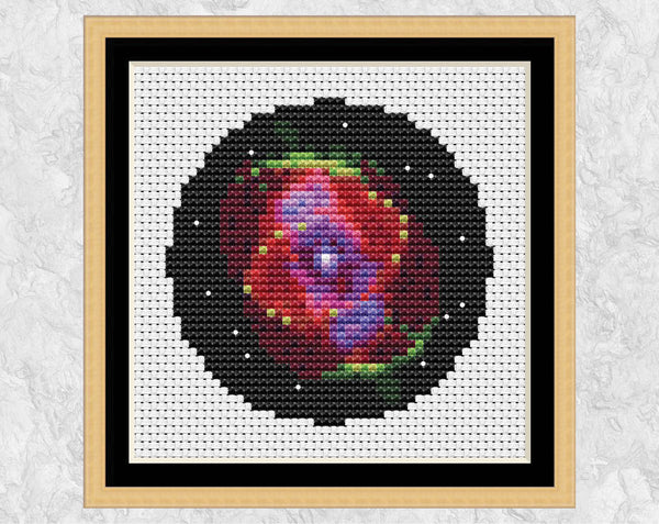 Cat's Eye Nebula cross stitch pattern in frame