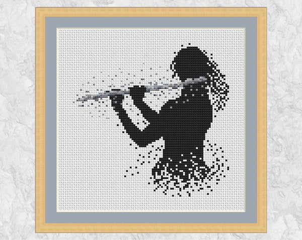 Female flutist or flute player music cross stitch pattern. Silver colourway shown with frame.